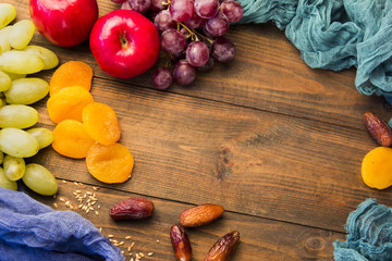 useful fruit on the table grapes, apples