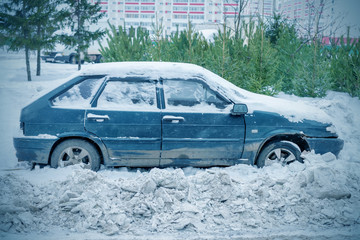 Car in the snow during a blizzard