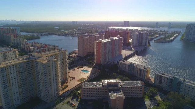 Aerial pull away shot Sunny Isles Beach highrise condominiums oceanfront 4k