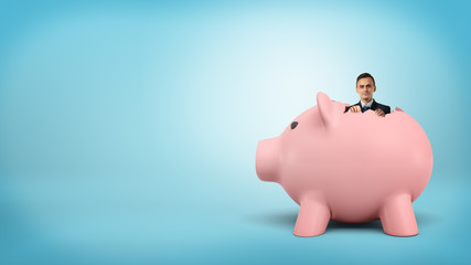 A small businessman sticking out his head from inside a large piggy bank.
