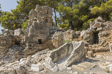 Fototapeta na wymiar Stone ruins of houses and the street of the ancient city of Phaselis.