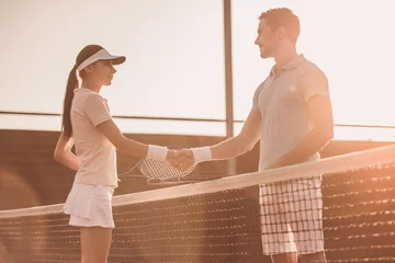 Poster Couple playing tennis © georgerudy