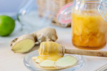 Healthy eating - honey and ginger root slices.