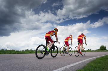 three bikers by race cycling contest