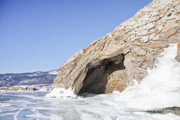 Cave in Cape Uyuga. Lake Baikal landscape..