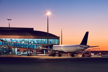 Airport at the colorful sunset - obrazy, fototapety, plakaty