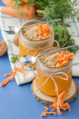 Carrot mousse with walnuts in a glass jar..