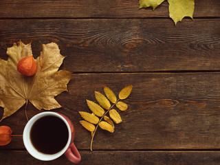  autumn coffee or tea warm leaves wooden surface background concept. Seasonal coziness. Disease prevention