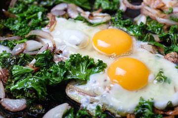 Fried eggs with vegetables.