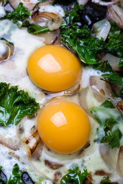 Fried eggs with vegetables.