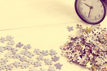 Concept alarm clock and puzzle. Toned.