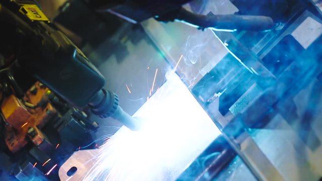 Industrial robot welding metal