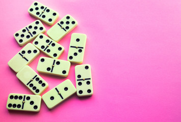 Domino on Pink background. Flat lay