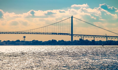 The Ambassador Bridge spans the Detroit River connecting Detroit with Windsor, Ontario, Canada.