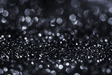 Black bokeh texture on black background