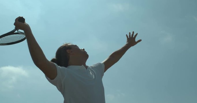  Super slow motion male tennis player hitting the ball during a game