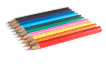 Obraz premium Colored Pencils in a Row, on white Background