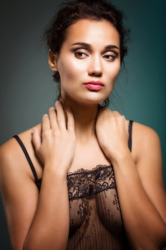 Young beautiful woman in transparent negligee