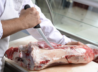 butcher removes the bone