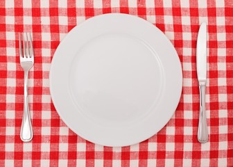 Table Setting with Plate, Fork and Knife on Checkered Table