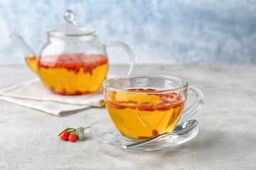 Cup with goji tea on table