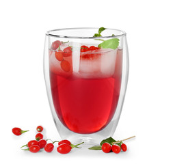 Glass with goji juice on white background