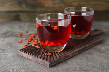 Glasses with goji juice on table