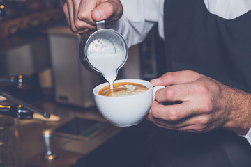 Coffee latte art in coffee shop vintage color