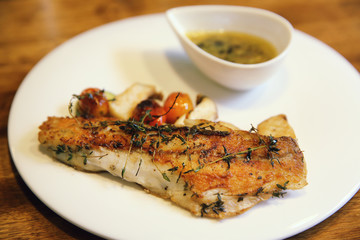 Sea bass fillet on wood background