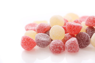 Colorful jelly sugar candies close up isolated in white background