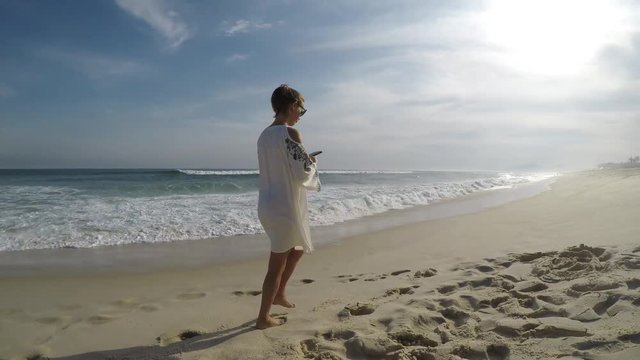 woman on the beach of Barra da Tijuca in Rio de Janeiro

