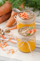 Fototapeta na wymiar Two jars of carrot mousse with walnut..