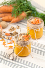 Carrot pudding with grated walnut on a tissue napkin..