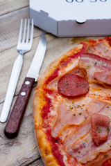 pizza slice with meatballs and bacon