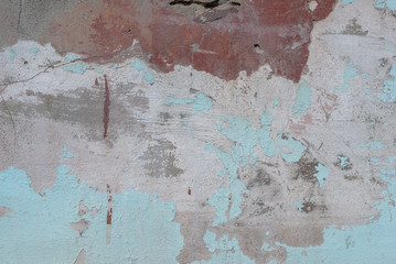 old chipped plaster on the concrete wall, background texture
