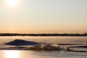 background of fresh white snow winter outdoor on the surface of the river covered with ice....