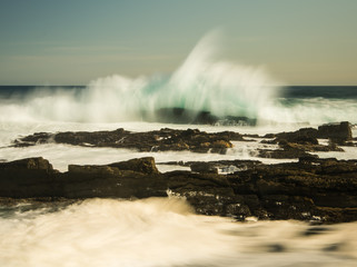 Waves breaking on shore