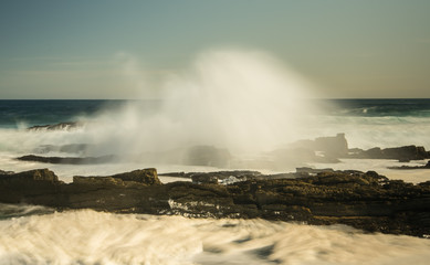 Waves breaking on shore