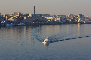 Boat floats down the river Dnieper. Kiev, Ukraine