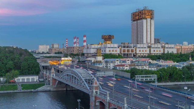 Evening view at the Russian Academy of Sciences day to night timelapse and Novoandreevsky Bridge over the Moscow River.