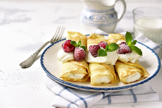 Crepes stuffed with ricotta.
