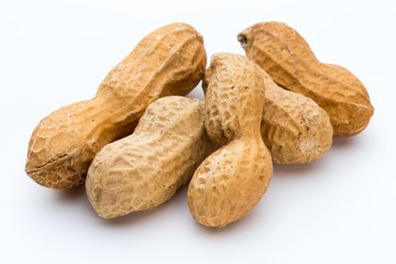 Dried peanuts on the white background.