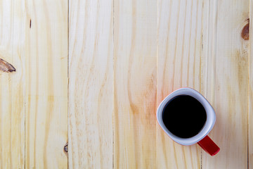 Coffee cup top view on wooden table background