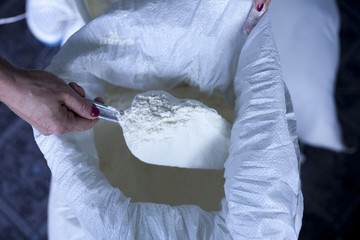 flour baker in kitchen close up on female hand