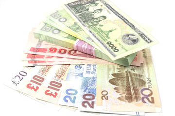Fototapeta na wymiar United Kingdom Pound Sterling, Thailand Baht, Chinese Yuan and Lao Kib Banknote.