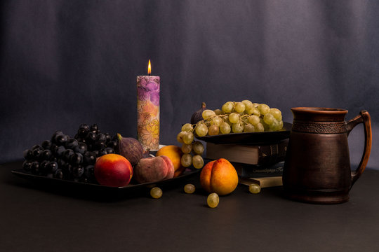 Still life art photography with books fruits on table