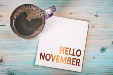 HELLO NOVEMBER note on a napkin with a cup of coffee © NatasaAdzic