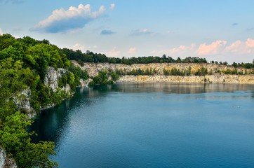 Fototapeta na wymiar Beautiful quarry with blue water. Water reservoir Zakrzowek in Krakow, Poland.