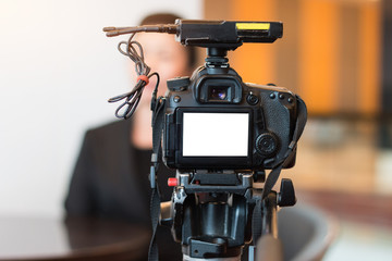 Blur of Video camera or camcorder operator working for record couple speaker or Presenterson stage...