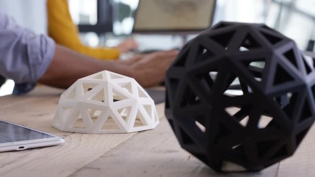  Engineering or design team working together, creating 3D printed objects